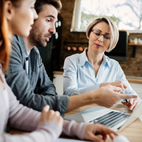A commercial banker explaining IBISWorld data to two clients
